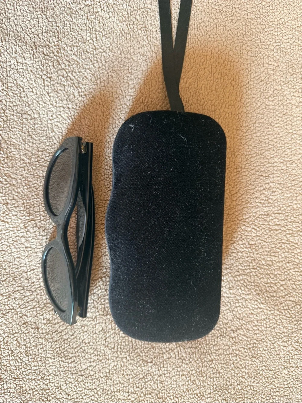Gucci Black Oval Sunglasses with Gold Logo Accent